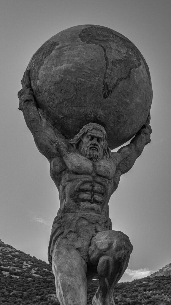 Monochrome image of Atlas statue holding the globe in Aydın, Türkiye.